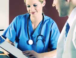 Nurse and Doctor Reviewing Documents in Prepartion for Ultrasound